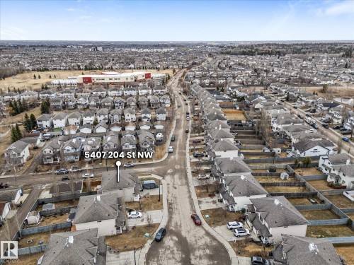 Aerial perspective showcasing a residential street with detached homes - 5407 204 Street, Edmonton, AB - Outdoor With View