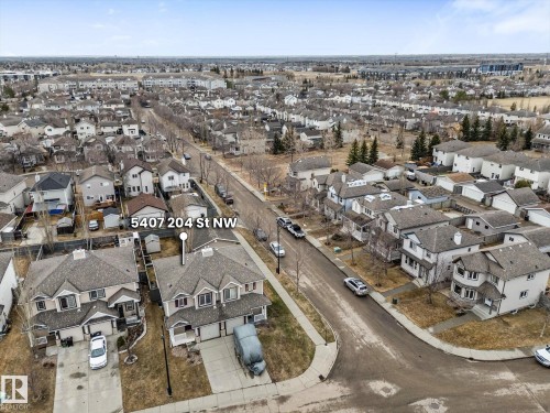 Aerial perspective showcasing a residential street with multiple detached homes - 5407 204 Street, Edmonton, AB - Outdoor With View
