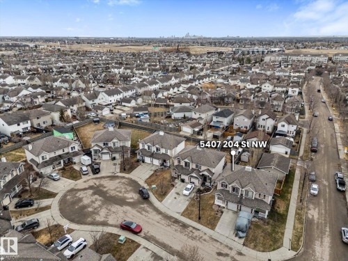 Aerial perspective of a residential neighborhood featuring detached homes and a central cul-de-sac - 5407 204 Street, Edmonton, AB - Outdoor With View