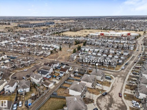 Aerial perspective of a residential community featuring single-family homes and multi-unit buildings - 5407 204 Street, Edmonton, AB - Outdoor With View