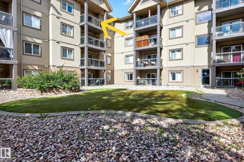 Multi-story building exterior with individual balconies featuring glass railings - 413 279 Suder Greens Drive, Edmonton, AB - Outdoor
