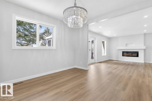 257 Knottwood Road N, Edmonton, AB - Indoor Photo Showing Living Room With Fireplace