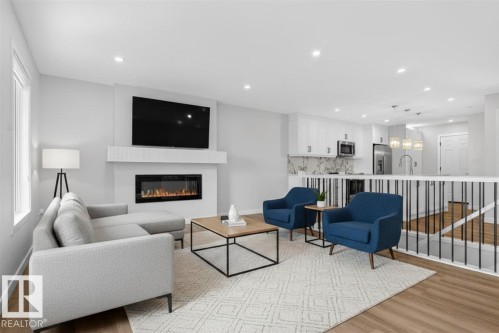 257 Knottwood Road N, Edmonton, AB - Indoor Photo Showing Living Room With Fireplace