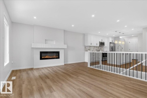 257 Knottwood Road N, Edmonton, AB - Indoor Photo Showing Living Room With Fireplace