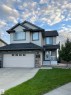 Contemporary two-story residence featuring light-colored siding and dark trim - 8477 Sloane Crescent, Edmonton, AB  - Outdoor With Facade 