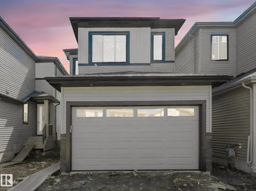 Contemporary multi-level exterior featuring light gray siding and dark trim accents - 272 Munn Way, Leduc, AB - Outdoor With Exterior