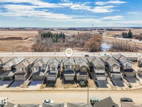 Newly constructed residence featuring a two-story design with an attached garage - 272 Munn Way, Leduc, AB - Outdoor With View