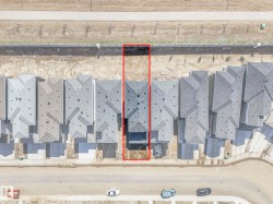 Aerial perspective of a property featuring a gray shingle roof and a concrete driveway - 