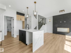 Kitchen island with waterfall countertop and undermount sink - 