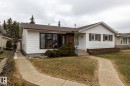 Single-story residence featuring white horizontal siding and a brown shingle roof - 8612 68A Street, Edmonton, AB  - Outdoor 
