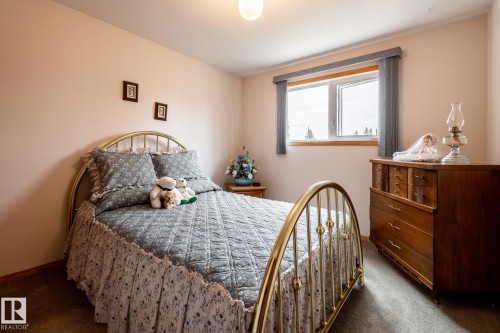 Bedroom featuring light-colored walls and carpet flooring - 8612 68A Street, Edmonton, AB - Indoor Photo Showing Bedroom