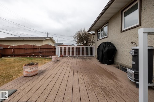 Expansive composite deck with white railing, offering ample outdoor living space - 8612 68A Street, Edmonton, AB - Outdoor With Deck Patio Veranda With Exterior