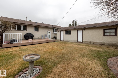 Expansive backyard with a large composite deck featuring white railing - 8612 68A Street, Edmonton, AB - Outdoor With Deck Patio Veranda