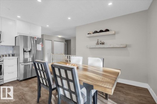 Dining room with a textured ceiling, recessed lighting, and dark wood-style floors - 3515 20 Avenue, Edmonton, AB - Indoor