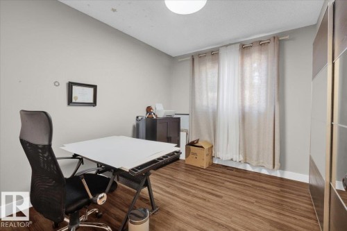 Office space featuring wood finished floors and a textured ceiling - 3515 20 Avenue, Edmonton, AB - Indoor Photo Showing Office