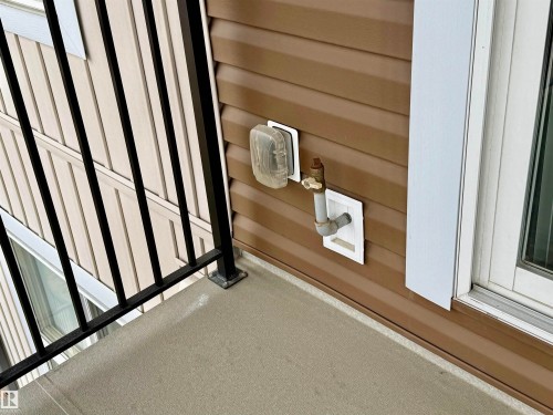 Exterior balcony with a black metal railing and a concrete surface - 437 5504 Schonsee Drive, Edmonton, AB -  Photo Showing Other Room