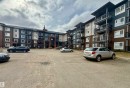 Multi-story residential building featuring a combination of brick, horizontal siding, and vertical paneling - 437 5504 Schonsee Drive, Edmonton, AB  - Outdoor With Balcony With Facade 