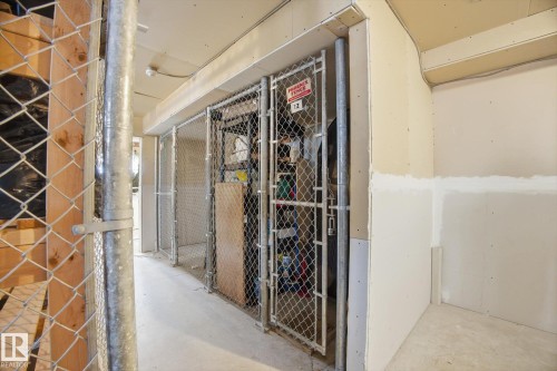 Individual storage units featuring chain-link construction and concrete flooring - 103 10732 86 Avenue, Edmonton, AB - Indoor
