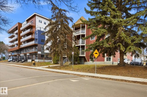 Modern multi-story building featuring balconies with glass railings - 103 10732 86 Avenue, Edmonton, AB - Outdoor With Facade