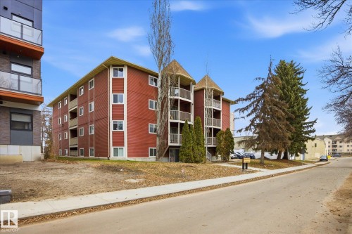 Multi-story apartment building featuring a red exterior facade - 103 10732 86 Avenue, Edmonton, AB - Outdoor With Facade