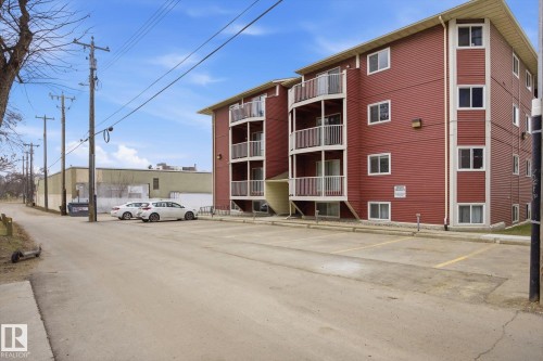 Multi-story residential building with red siding and white trim - 103 10732 86 Avenue, Edmonton, AB - Outdoor