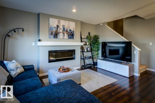 5487 Crabapple Loop Sw, Edmonton, AB - Indoor Photo Showing Living Room With Fireplace