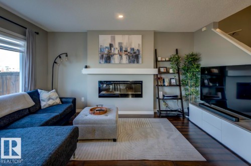 5487 Crabapple Loop Sw, Edmonton, AB - Indoor Photo Showing Living Room With Fireplace