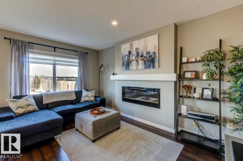 5487 Crabapple Loop Sw, Edmonton, AB - Indoor Photo Showing Living Room With Fireplace