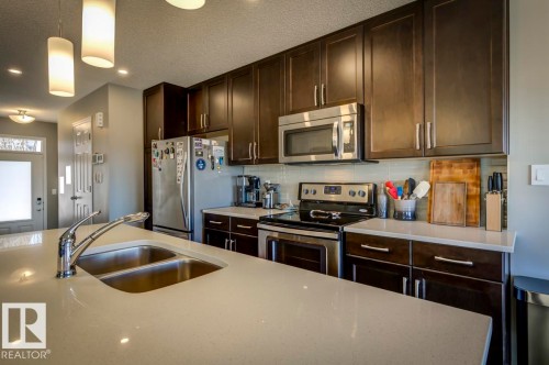 5487 Crabapple Loop Sw, Edmonton, AB - Indoor Photo Showing Kitchen With Double Sink