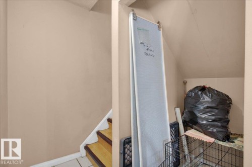 Staircase featuring wood treads and white risers - 412 2908 116A Avenue, Edmonton, AB - Indoor