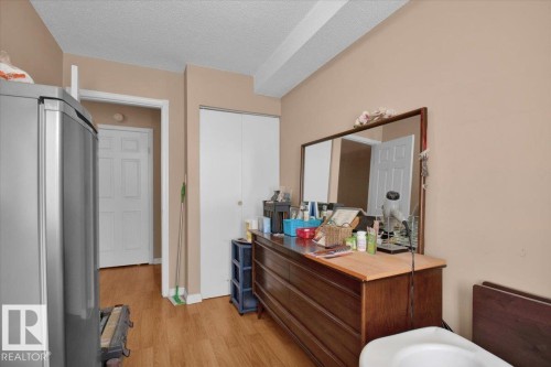 This room features light brown walls and wood flooring - 412 2908 116A Avenue, Edmonton, AB - Indoor Photo Showing Bathroom
