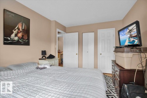 This bedroom features light tan walls and white trim - 412 2908 116A Avenue, Edmonton, AB - Indoor Photo Showing Bedroom