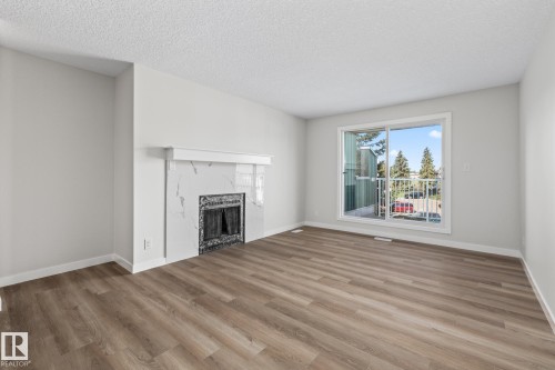 308 6208 180 Street, Edmonton, AB - Indoor Photo Showing Living Room With Fireplace