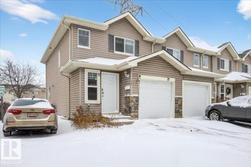 Traditional-style home with stone siding - 47 230 Edwards Drive, Edmonton, AB - Outdoor With Facade