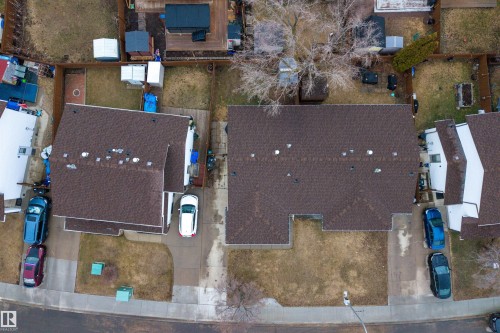 Brown shingle roofing, paved driveway, and a large backyard - 17120 103 Street, Edmonton, AB - Outdoor