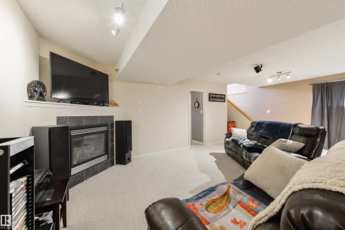 7 Hilldowns Drive, Spruce Grove, AB - Indoor Photo Showing Living Room With Fireplace