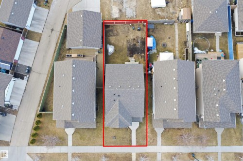 Single-family residence with a front walkway, grey shingle roofing, and a rear yard - 1124 37A Avenue, Edmonton, AB - 