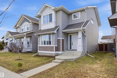 Contemporary two-story residence featuring light gray siding and a contrasting dark gray roof - 1124 37A Avenue, Edmonton, AB - Outdoor With Facade