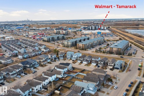 Aerial perspective showcasing a residential area with detached homes and multi-story apartment buildings - 1124 37A Avenue, Edmonton, AB - Outdoor With View