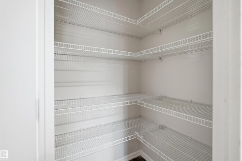 Spacious pantry with multiple levels of wire shelving - 1124 37A Avenue, Edmonton, AB - Indoor With Storage