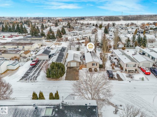 Single-story property featuring light-toned siding and a dark-shingled roof - 151 3400 48 Street, Stony Plain, AB - Outdoor With View