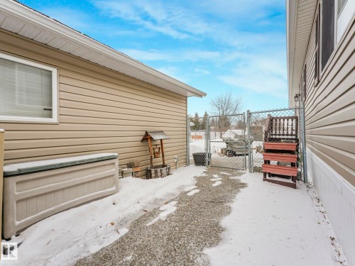 Chain link fence with gate providing property enclosure - 151 3400 48 Street, Stony Plain, AB - Outdoor With Exterior