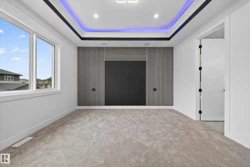 Recessed tray ceiling with integrated lighting - 4005 39 Street, Beaumont, AB - Indoor Photo Showing Other Room