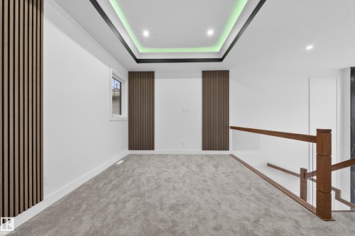 Upper-level space featuring recessed lighting and a tray ceiling with accent lighting - 4005 39 Street, Beaumont, AB - Indoor Photo Showing Other Room
