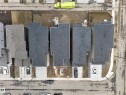 New construction properties featuring asphalt shingle roofing, concrete driveways, and adjacent street parking - 4005 39 Street, Beaumont, AB  - Other 