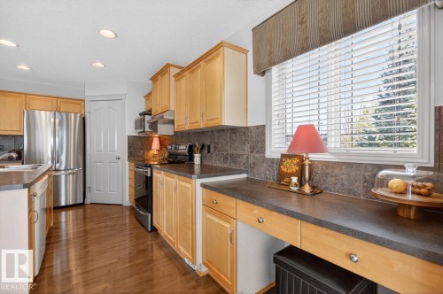 Kitchen featuring wood-finish flooring, recessed lighting, and light wood cabinetry - 2178 Haddow Drive, Edmonton, AB - Indoor Photo Showing Kitchen