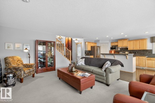Open-concept living space with light gray wall paint and recessed lighting - 2178 Haddow Drive, Edmonton, AB - Indoor Photo Showing Living Room