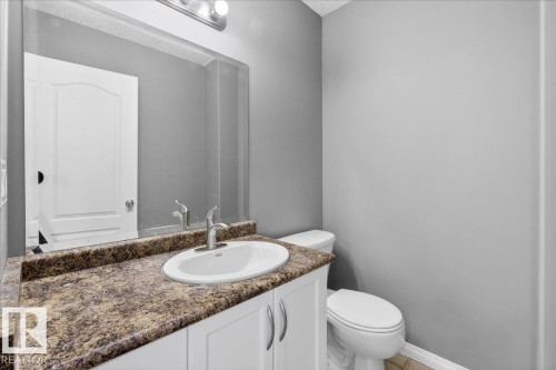 Half bath with vanity and toilet - 150 Acacia Circle, Leduc, AB - Indoor Photo Showing Bathroom