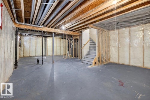 Unfinished below grade area with stairway - 150 Acacia Circle, Leduc, AB - Indoor Photo Showing Basement