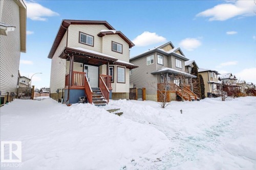 View of front of home featuring stairway and a residential view - 150 Acacia Circle, Leduc, AB - Outdoor